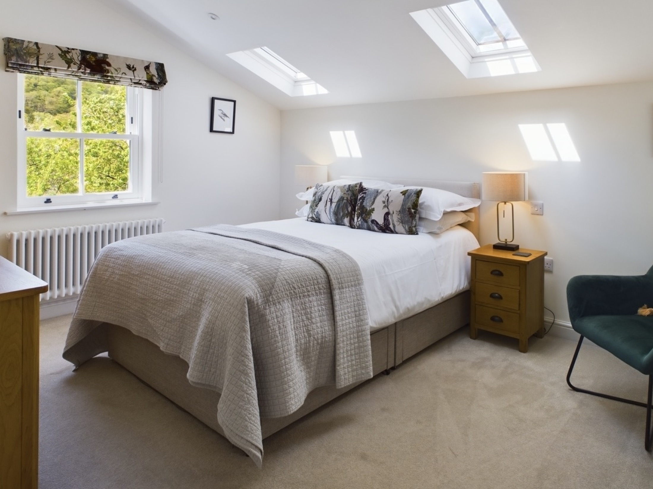 Bright double bedroom with skylights