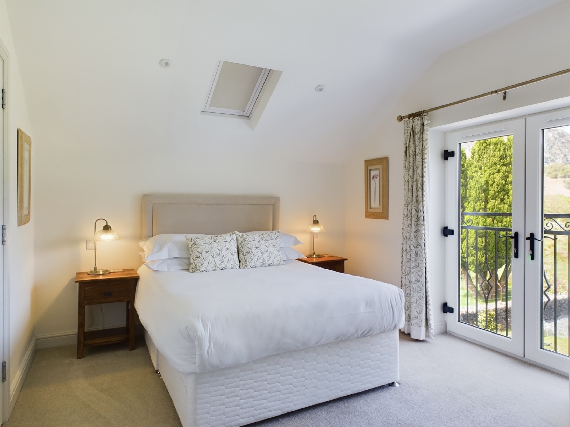 Bedroom with balcony doors and countryside view